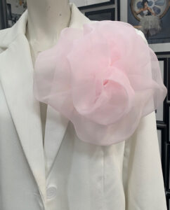 A bold organza rosette in soft baby pink. Each piece is handmade and designed with a brooch pin on the back, making it easy to attach to dresses, blazers, or belts to add volume and a standout detail to your look designed by Gudnitz Copenhagen