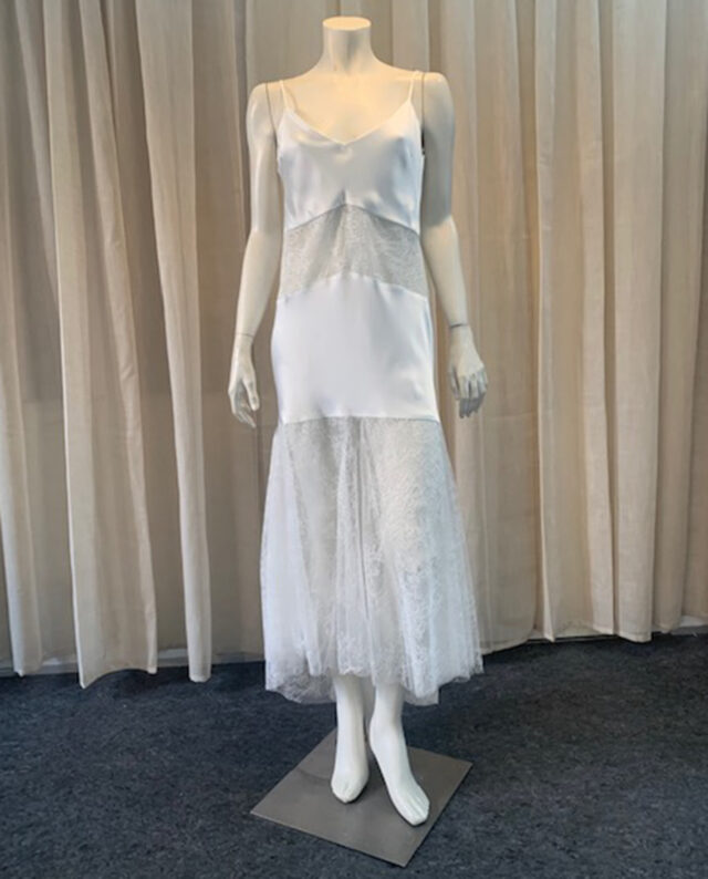 Elegant satin and lace dress featuring a low back. The refined mix of smooth satin and delicate lace creates a timeless look. Designed by Rikke Gudnitz for Gudnitz Copenhagen